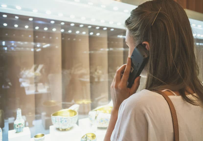 Woman holding an audio guide